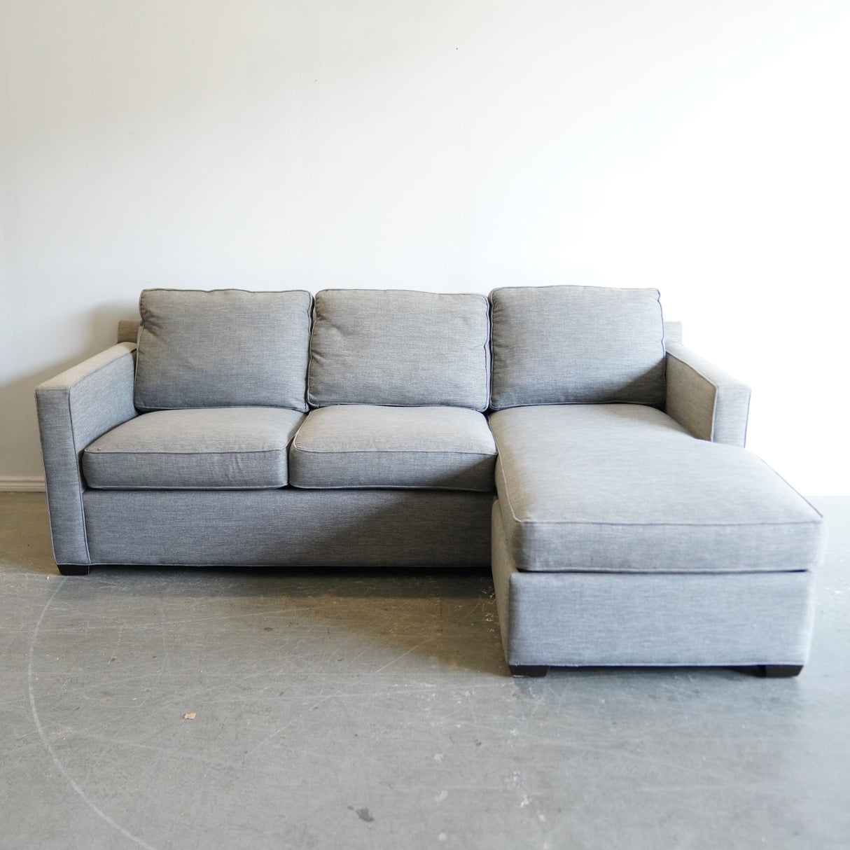 Crate and Barrel Reversible sectional sofa with storage