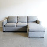 Crate and Barrel Reversible sectional sofa with storage
