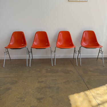 Vintage! Herman Miller Eames fiberglass orange shell stacking chairs