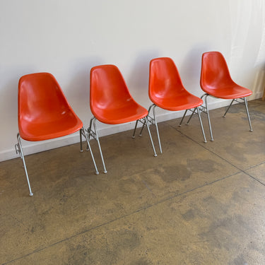 Vintage! Herman Miller Eames fiberglass orange shell stacking chairs