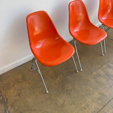 Vintage! Herman Miller Eames fiberglass orange shell stacking chairs