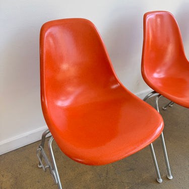 Vintage! Herman Miller Eames fiberglass orange shell stacking chairs