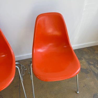 Vintage! Herman Miller Eames fiberglass orange shell stacking chairs